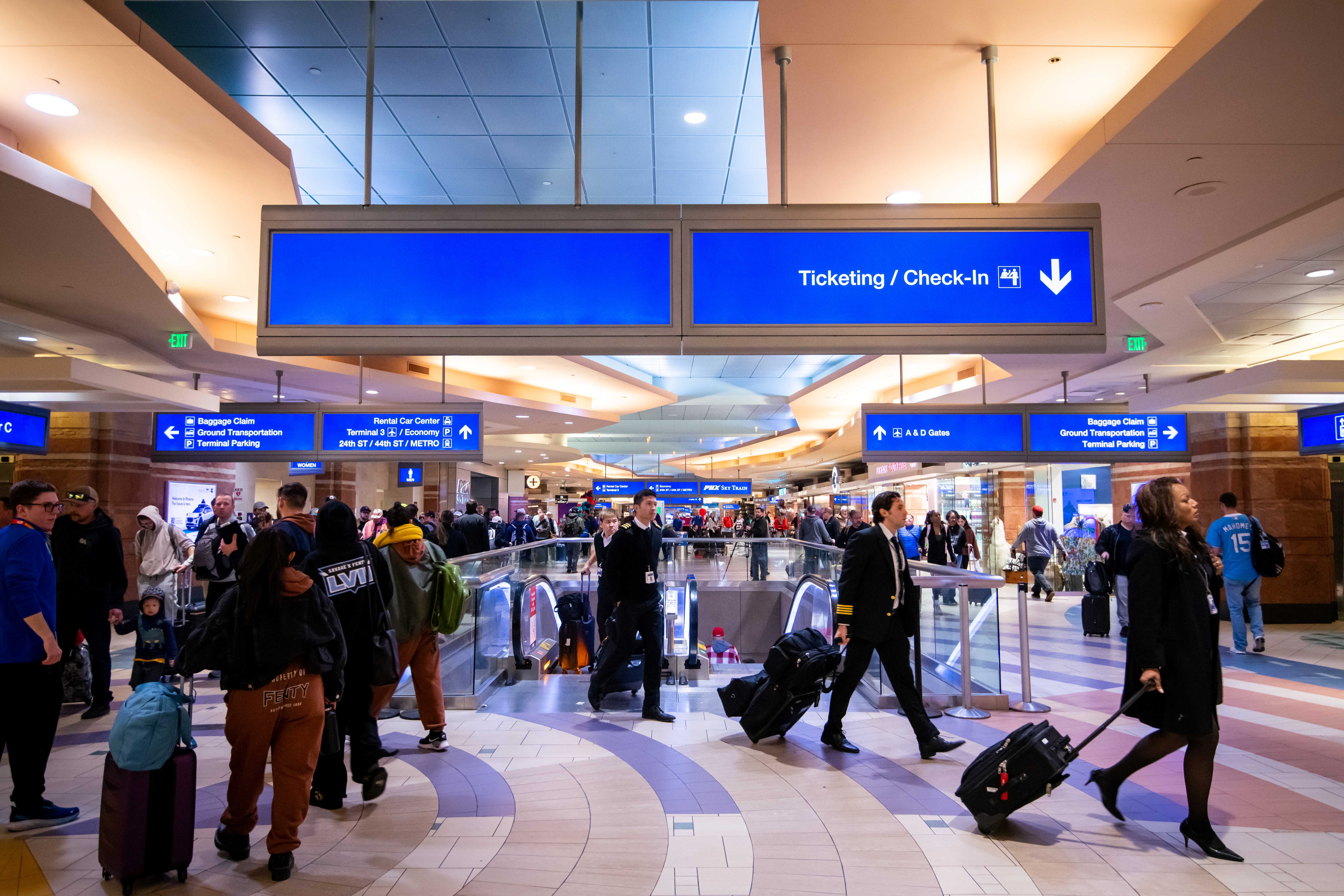 Terminal 4 with busy passenger crowds